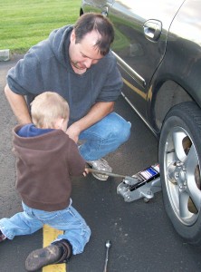 Changing the tire.