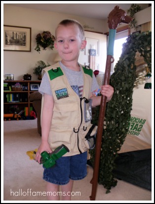Backyard Safari Outfitters vest, walking stick, and bug wrangler.