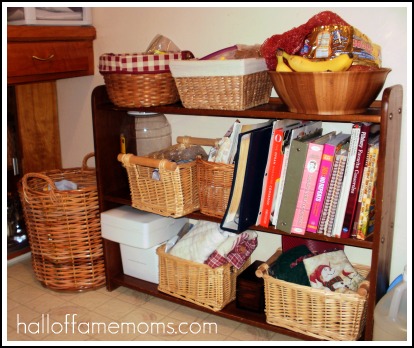 Old book shelf and pretty baskets for kitchen storage.