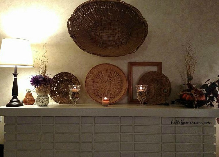 Old #baskets can make a #fireplace mantel cozy for fall. #frugalhomedecor